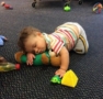 toddler_cuddling_with_teddy_bear_growing_kids_academy_fredericksburg_va-471x450